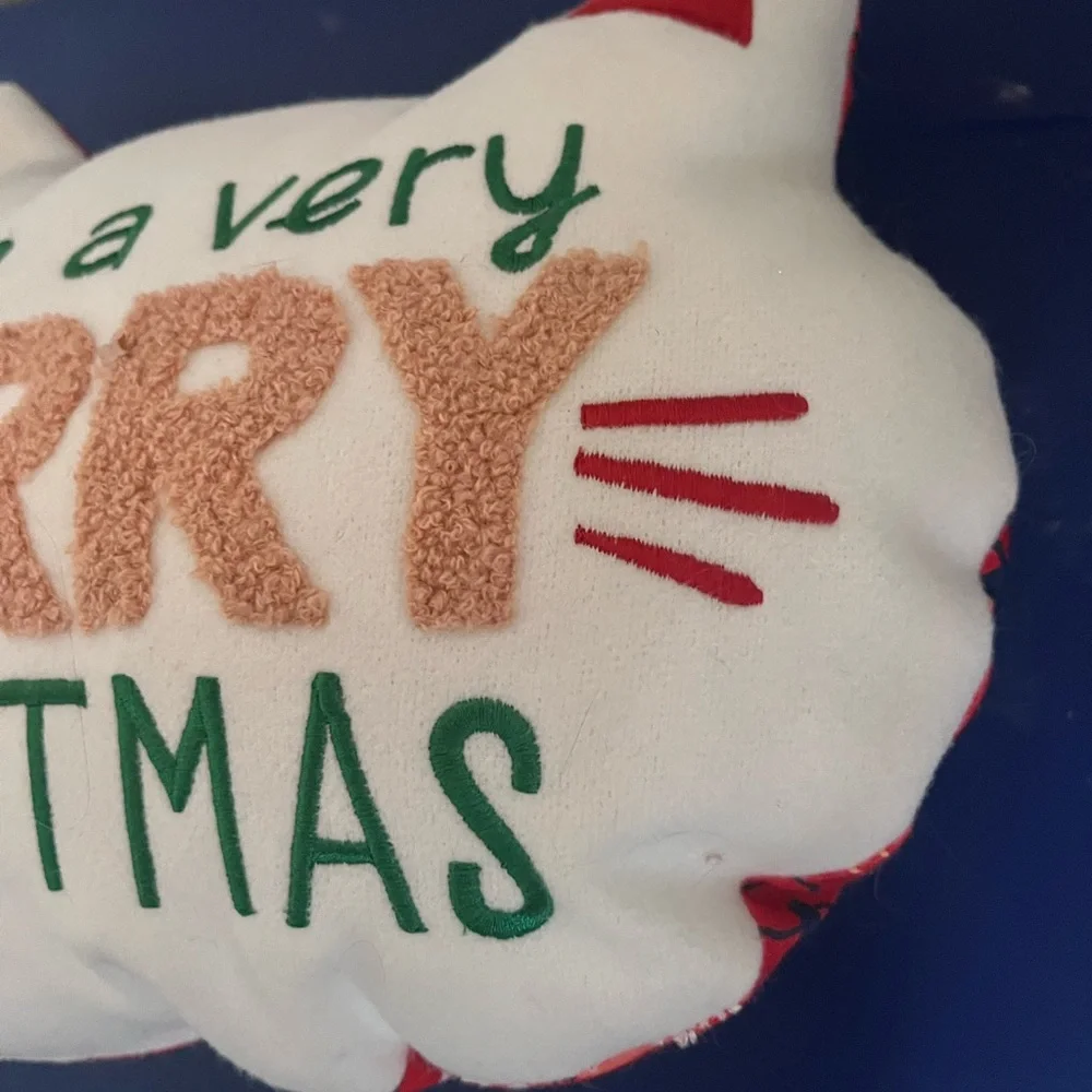 Wonder shop have a very furry Christmas cat pillow